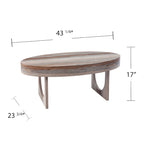 Table basse ovale contemporaine en similicuir marbré marron avec pieds géométriques